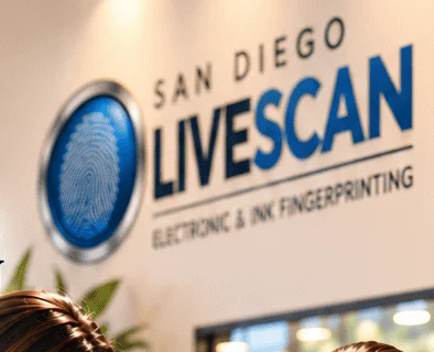 The San Diego Livescan sign in a bright office lobby